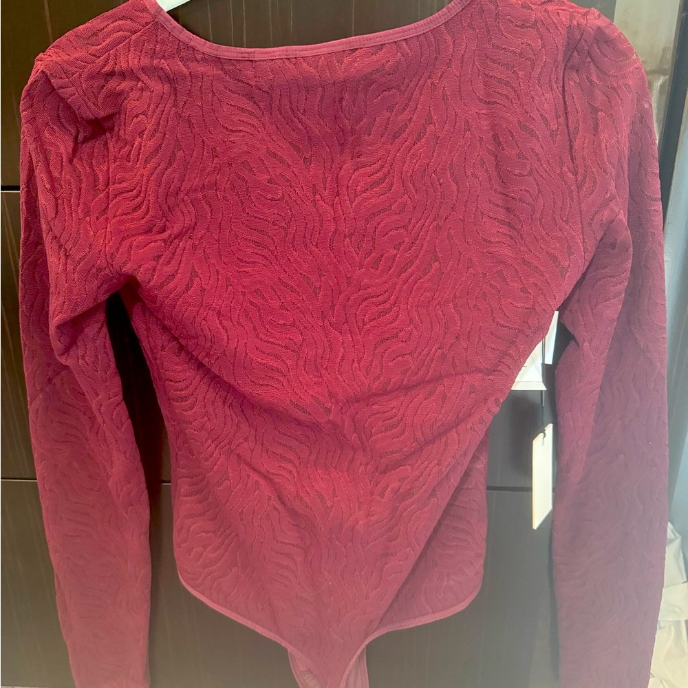 Contour v-neck long sleeve body suit. Rich maroon color